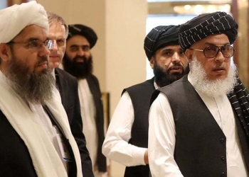 The Taliban's former envoy to Saudi Arabia Shahabuddin Delawar (L) arrives with Taliban negotiator Abbas Stanikzai (R), along with Taliban Qatar spokesman Suhail Shaheen (2nd-R), and the Taliban's former culture and information minister Amir Khan Mutaqi to attend the Intra Afghan Dialogue talks in the Qatari capital Doha on July 7, 2019. - Dozens of powerful Afghans met with a Taliban delegation on July 7, amid separate talks between the US and the insurgents seeking to end 18 years of war. The separate intra-Afghan talks are attended by around 60 delegates, including political figures, women and other Afghan stakeholders. The Taliban, who have steadfastly refused to negotiate with the government of President Ashraf Ghani, have stressed that those attending are only doing so in a "personal capacity". (Photo by KARIM JAAFAR / AFP)