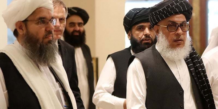 The Taliban's former envoy to Saudi Arabia Shahabuddin Delawar (L) arrives with Taliban negotiator Abbas Stanikzai (R), along with Taliban Qatar spokesman Suhail Shaheen (2nd-R), and the Taliban's former culture and information minister Amir Khan Mutaqi to attend the Intra Afghan Dialogue talks in the Qatari capital Doha on July 7, 2019. - Dozens of powerful Afghans met with a Taliban delegation on July 7, amid separate talks between the US and the insurgents seeking to end 18 years of war. The separate intra-Afghan talks are attended by around 60 delegates, including political figures, women and other Afghan stakeholders. The Taliban, who have steadfastly refused to negotiate with the government of President Ashraf Ghani, have stressed that those attending are only doing so in a "personal capacity". (Photo by KARIM JAAFAR / AFP)