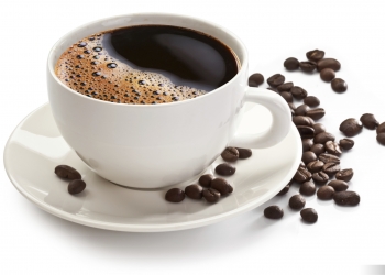 Coffee cup and beans on a white background.