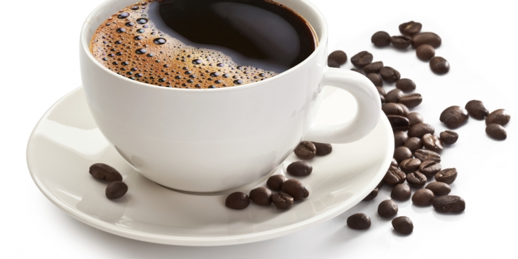 Coffee cup and beans on a white background.