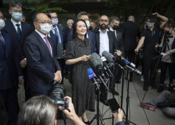 Meng Wanzhou, chief financial officer of Huawei, reads a statement outside B.C. Supreme Court, in Vancouver, B.C., Friday, Sept. 24, 2021. THE CANADIAN PRESS/Darryl Dyck