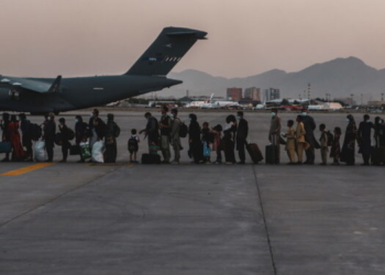 FILE PHOTO: Evacuees wait to board a Boeing C-17 Globemaster III during an evacuation at Hamid Karzai International Airport in Kabul, Afghanistan, August 23, 2021. Picture taken August 23, 2021. U.S. Marine Corps/Sgt. Isaiah Campbell/Handout via REUTERS