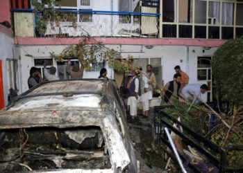 FILE - In this Sunday, Aug. 29, 2021 file photo, Afghans inspect damage of Ahmadi family house after U.S. drone strike in Kabul, Afghanistan, Sunday, Aug. 29, 2021. Ahmadi says Sunday's U.S. drone strike killed 10 members of his family, six of them children. Senior U.S. military officials said the drone strike hit an Islamic State target and disrupted the extremist' ability to further disrupt the final phase of the U.S. withdrawal from Afghanistan. (AP Photo/Khwaja Tawfiq Sediqi, File)