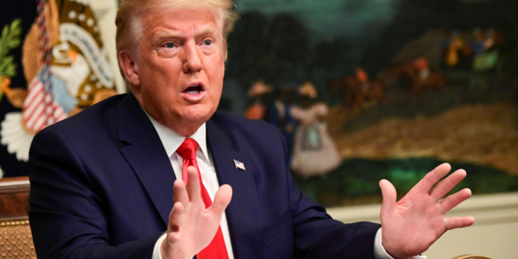 U.S. President Donald Trump speaks to reporters after he participated in a Thanksgiving video teleconference with members of the military forces at the White House in Washington, U.S., November 26, 2020.  REUTERS/Erin Scott