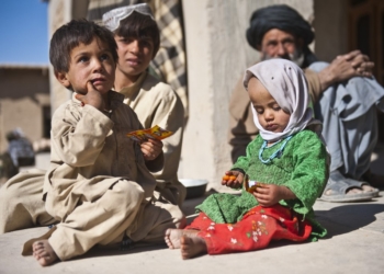 Afghan children enjoy American candy given to them by a U.S. Army Soldier with Special Operations Task Force - South, Nov. 27, 2010, in Maiwand District, Kandahar Province, Afghanistan. (U.S. Army photo by Spc. Daniel P. Shook / Special Operations Task Force - South)(Released)