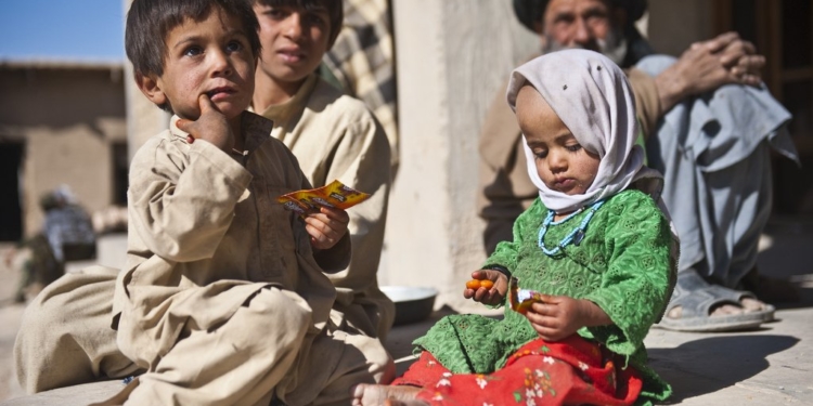 Afghan children enjoy American candy given to them by a U.S. Army Soldier with Special Operations Task Force - South, Nov. 27, 2010, in Maiwand District, Kandahar Province, Afghanistan. (U.S. Army photo by Spc. Daniel P. Shook / Special Operations Task Force - South)(Released)