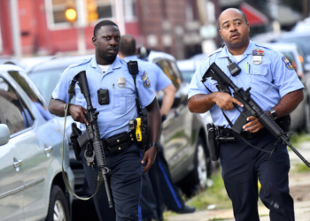 PHILADELPHIA, PA - AUGUST 14: Police officers carrying assault rifles respond to a shooting on August 14, 2019 in Philadelphia, Pennsylvania. At least six police officers were reportedly wounded in an hours-long standoff with a gunman that prompted a massive law enforcement response in the city's Nicetown-Tioga neighborhood. (Photo by Mark Makela/Getty Images)