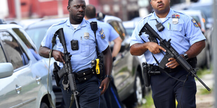 PHILADELPHIA, PA - AUGUST 14: Police officers carrying assault rifles respond to a shooting on August 14, 2019 in Philadelphia, Pennsylvania. At least six police officers were reportedly wounded in an hours-long standoff with a gunman that prompted a massive law enforcement response in the city's Nicetown-Tioga neighborhood. (Photo by Mark Makela/Getty Images)
