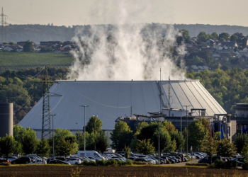 Smoke rises from the nuclear power plant of Nerckarwestheim in Neckarwestheim, Germany, Monday, Aug. 22, 2022. Europe is facing an energy crisis that could lead to rolling blackouts, shuttered factories and a deep recession. Germany is sticking to its long-held plan of shutting down the country's three remaining nuclear power plants this year but keeping the option of reactivating two of them in case of an energy shortage in the coming months. (AP Photo/Michael Probst)