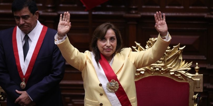 Former Vice President Dina Boluarte acknowledges lawmakers after she was sworn in as president in Lima, Peru, Wednesday, Dec. 7, 2022. Behind is Congress President Jose Williams. Peru's Congress voted to remove President Pedro Castillo from office Wednesday and replace him with the vice president, shortly after Castillo tried to dissolve the legislature ahead of a scheduled vote to remove him. (AP Photo/Guadalupe Pardo)