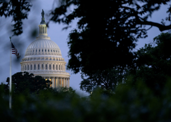 The U.S. Capitol building and American flag. Photographer: Stefani Reynolds/Bloomberg