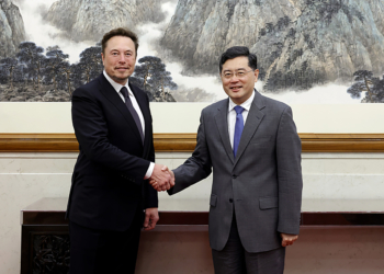 In this photo taken Tuesday, May 30 2023 and released by Ministry of Foreign Affairs of the People's Republic of China, China's Foreign Minister Qin Gang, right, poses for photos with Tesla Ltd. CEO Elon Musk in Beijing. China’s foreign minister met Tesla Ltd. CEO Elon Musk on Tuesday and said strained U.S.-Chinese relations require “mutual respect,” while delivering a message of reassurance that foreign companies are welcome. (Ministry of Foreign Affairs of the People's Republic of China via AP)
