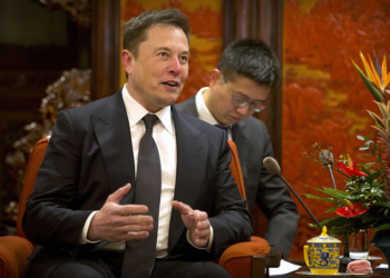 Tesla CEO Elon Musk speaks during a meeting with Chinese Premier Li Keqiang, not shown, at the Zhongnanhai leadership compound in Beijing, Wednesday, Jan. 9, 2019. (AP Photo/Mark Schiefelbein, Pool)