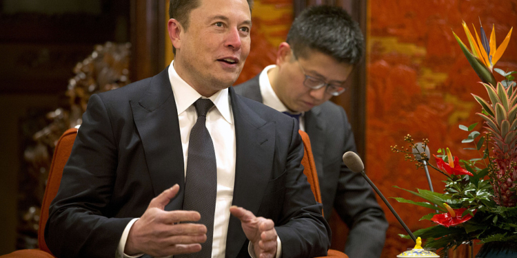 Tesla CEO Elon Musk speaks during a meeting with Chinese Premier Li Keqiang, not shown, at the Zhongnanhai leadership compound in Beijing, Wednesday, Jan. 9, 2019. (AP Photo/Mark Schiefelbein, Pool)