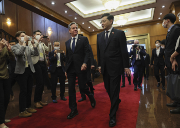 U.S. Secretary of State Antony Blinken, center, left, walks with Chinese Foreign Minister Qin Gang, center right, at the Diaoyutai State Guesthouse in Beijing, China, Sunday, June 18, 2023. (Leah Millis/Pool Photo via AP)