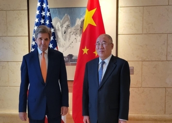 John Kerry, US special presidential envoy for climate, left, greets Xie Zhenhua, China's special envoy for climate change, ahead of talks in Beijing, China, on Monday, July 17, 2023. Kerry opened the first major climate talks with Chinese officials in almost a year, as both sides pledged to work for tangible results despite deep tensions between the superpowers. Photographer: Jennifer A. Dlouhy/Bloomberg