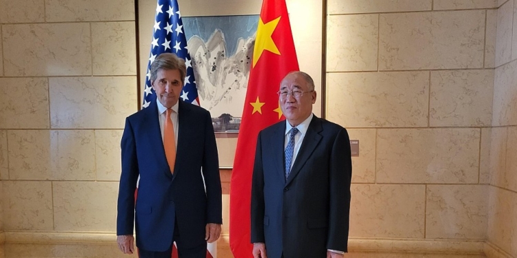 John Kerry, US special presidential envoy for climate, left, greets Xie Zhenhua, China's special envoy for climate change, ahead of talks in Beijing, China, on Monday, July 17, 2023. Kerry opened the first major climate talks with Chinese officials in almost a year, as both sides pledged to work for tangible results despite deep tensions between the superpowers. Photographer: Jennifer A. Dlouhy/Bloomberg