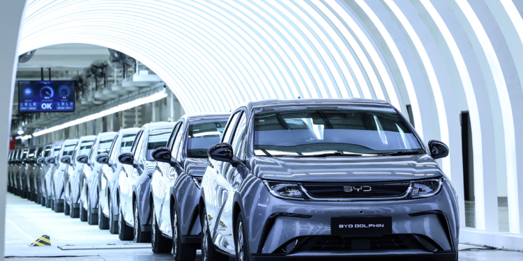 BYD Co. Dolphin compact hatchback electric vehicles at the launch of the company's new plant in Nikhom Phatthana, Rayong province, Thailand, on Thursday, July 4, 2024. BYD's shares have defied heavy losses in EV stocks around the world to gain more than 6% in Hong Kong this year thanks to the introduction of the fifth generation of its plug-in hybrid drive system in May. Photographer: Valeria Mongelli/Bloomberg