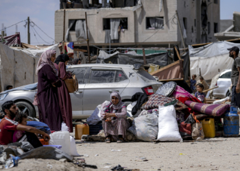 Palestinians displaced by the Israeli air and ground offensive on the Gaza Strip flee from Hamad City, following an evacuation order by the Israeli army to leave parts of the southern area of Khan Younis, Sunday, Aug. 11, 2024. (AP Photo/Abdel Kareem Hana)