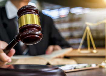 Close up of judge holding gavel