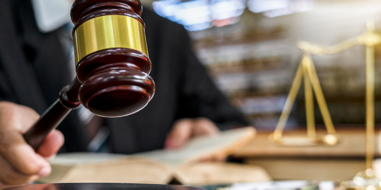 Close up of judge holding gavel