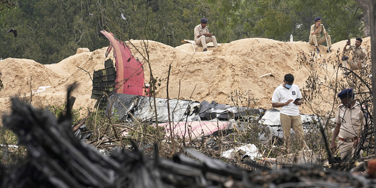 Police personnel work at the site of an Air India plane crash in Ahmedabad, India, Friday, June 13, 2025. (AP Photo/Rafiq Maqbool)