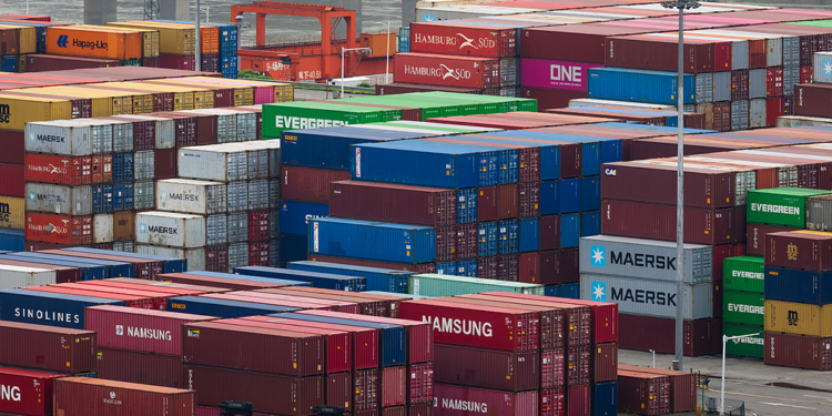 CHONGQING, CHINA - JULY 20: Intermodal shipping containers from global logistics companies including Maersk, Evergreen, ONE, Hamburg Süd, Samsung, and CMA CGM are seen stacked at the Guoyuan Operations Area of the Port of Chongqing, located along the Yangtze River and known as the largest inland intermodal terminal in China, on July 20, 2025 in Chongqing, China. (Photo by Cheng Xin/Getty Images)