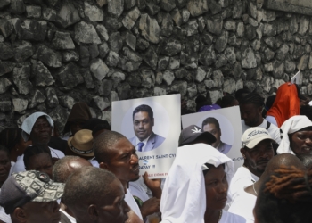 Supporters celebrate the installation of Laurent Saint-Cyr, who replaces Fritz Alphonse Jean, in the rotating presidency of the transitional presidential council in Port-au-Prince, Haiti, Thursday, Aug. 7, 2025. (AP Photo/Odelyn Joseph)