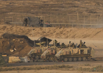 Israeli soldiers take position along the Gaza Strip border in southern Israel, Sunday, Oct. 5, 2025. (AP Photo/Ariel Schalit)