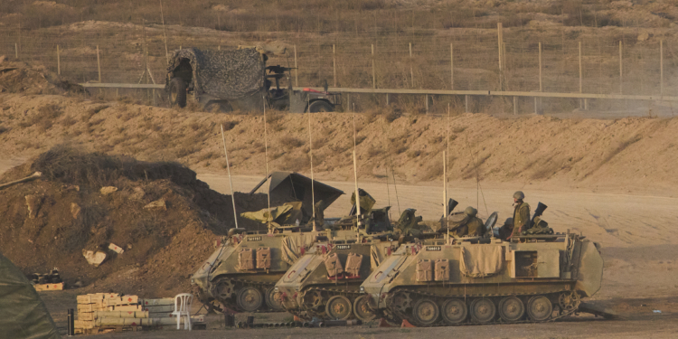 Israeli soldiers take position along the Gaza Strip border in southern Israel, Sunday, Oct. 5, 2025. (AP Photo/Ariel Schalit)