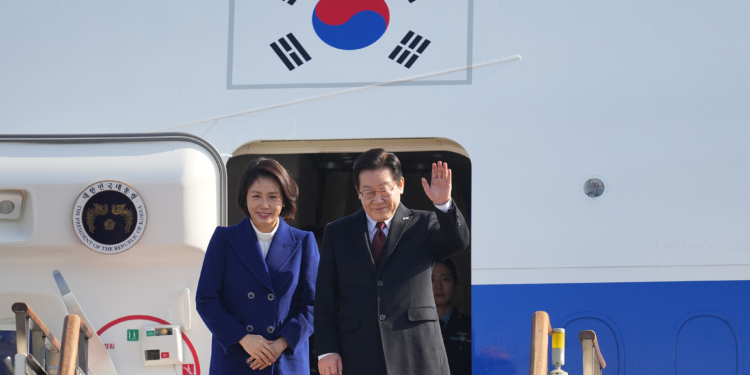 South Korean President Lee Jae Myung and his wife Kim Hea Kyung prepare to leave for China at the Seoul airport in Seongnam, South Korea, Sunday, Jan. 4, 2026. (AP Photo/Lee Jin-man)