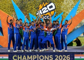 TOPSHOT - India's players celebrate with the trophy after winning the 2026 ICC Men's T20 Cricket World Cup final match against New Zealand at the Narendra Modi Stadium in Ahmedabad on March 8, 2026. (Photo by Punit PARANJPE / AFP via Getty Images)