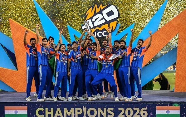 TOPSHOT - India's players celebrate with the trophy after winning the 2026 ICC Men's T20 Cricket World Cup final match against New Zealand at the Narendra Modi Stadium in Ahmedabad on March 8, 2026. (Photo by Punit PARANJPE / AFP via Getty Images)