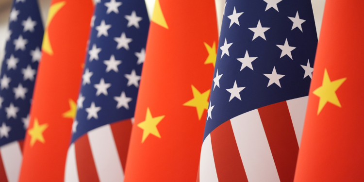 The U.S. and Chinese flag at the Great Hall of the People prior to the state dinner of President Donald Trump and Chinese President Xi Jinping on Thursday May 14, 2026, in Beijing. (AP Photo/Mark Schiefelbein)