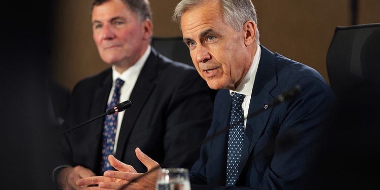 Prime Minister Mark Carney, right, and Canada-U.S. Trade Minister Dominic LeBlanc, left, meet with Canada's premiers in Charlottetown on Thursday, July 23, 2026. (Darren Calabrese /The Canadian Press via AP)