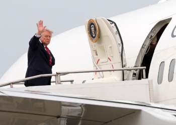 President Donald Trump waves as he departs on Air Force One at Oakland County International Airport, Monday, July 27, 2026, in Waterford Township, Mich. (AP Photo/Alex Brandon)