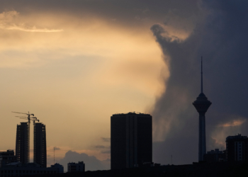 Milad telecommunication tower, right, and other buildings are seen during a cloudy sunset in Tehran, Iran, Sunday, April 5, 2026. (AP Photo/Vahid Salemi)