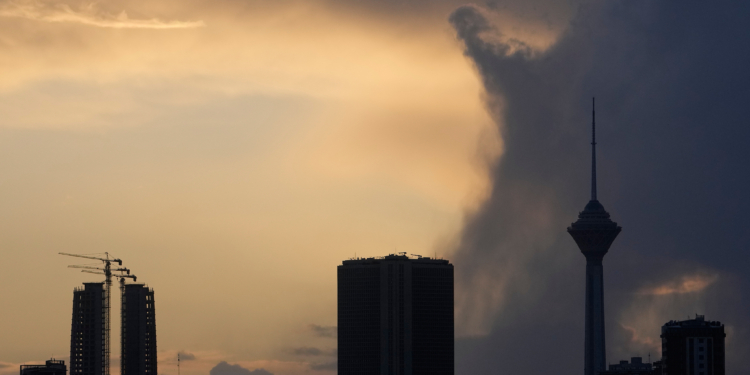 Milad telecommunication tower, right, and other buildings are seen during a cloudy sunset in Tehran, Iran, Sunday, April 5, 2026. (AP Photo/Vahid Salemi)