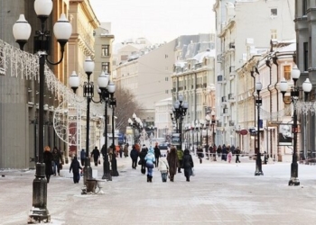 MOSCOW, RUSSIA - JANUARY 19, 2014: view of Arbat street and tourists in Moscow. Arbat has existed since the 15th century, it is pedestrian street about one km long in historical centre of Moscow