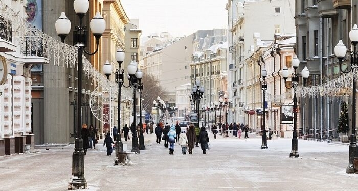 MOSCOW, RUSSIA - JANUARY 19, 2014: view of Arbat street and tourists in Moscow. Arbat has existed since the 15th century, it is pedestrian street about one km long in historical centre of Moscow
