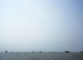 BANDAR ABBAS, IRAN - AUGUST 10: Ships are anchored in the Strait of Hormuz on August 10, 2026 off the coast of Bandar Abbas, Iran. In a recent statement, Iran's Supreme National Security Council said the vital waterway would not reopen until the United States "corrects its behavior," demanding that the U.S. end its war on Iran and compensate the country for war damage, among other conditions. Iran has largely halted vessel traffic through the strait with the threat of strikes; meanwhile, the U.S. has imposed a blockade on Iranian ports. (Photo by Ali Saeedi/Getty Images)