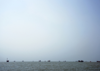 BANDAR ABBAS, IRAN - AUGUST 10: Ships are anchored in the Strait of Hormuz on August 10, 2026 off the coast of Bandar Abbas, Iran. In a recent statement, Iran's Supreme National Security Council said the vital waterway would not reopen until the United States "corrects its behavior," demanding that the U.S. end its war on Iran and compensate the country for war damage, among other conditions. Iran has largely halted vessel traffic through the strait with the threat of strikes; meanwhile, the U.S. has imposed a blockade on Iranian ports. (Photo by Ali Saeedi/Getty Images)