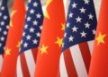 The U.S. and Chinese flag at the Great Hall of the People prior to the state dinner of President Donald Trump and Chinese President Xi Jinping on Thursday May 14, 2026, in Beijing. (AP Photo/Mark Schiefelbein)