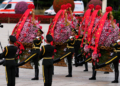 A military honor guard presents flower baskets to fallen national heroes at the Monument to the People's Heroes to mark Martyrs' Day at Tiananmen Square in Beijing, Wednesday, Sept. 30, 2026. (AP Photo/Ng Han Guan)